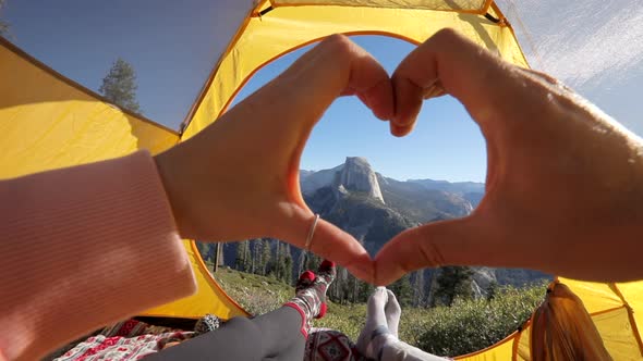 A Hand Heart Against the Background of the Picturesque View of Half Dome Cliff. Yosemite Valley, USA alt