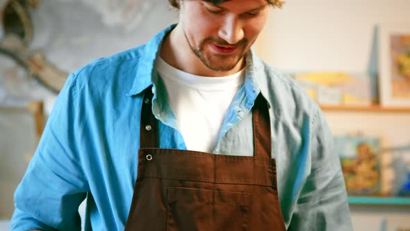 Smiling mature man with a mosaic alt