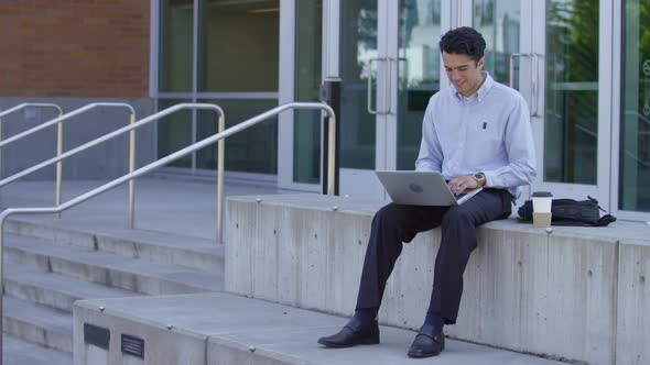 Young businessman using laptop