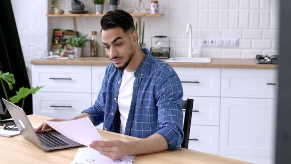 Focused Serious Arabian or Indian Guy with Glasses Freelancer or Office Worker Working Remotely Sit alt