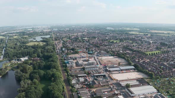 Slider drone shot over building development Cheshunt and natural reserve Lea river alt