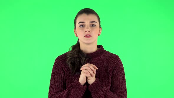 Woman Looking at Camera with Anticipation, Then Very Upset, Green Screen alt