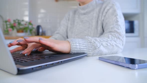 Girl working online with laptop computer and fast internet connection during lockdown in 4k video alt