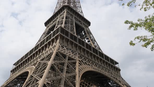 Recognizable Parisian an French Eiffel tower monument by the day 4K 2160p 30fps UHD video - Beautifu alt