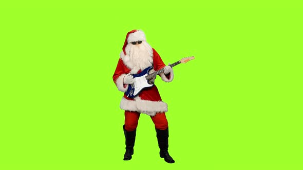 Santa in Sunglasses Playing Guitar at Christmas Party on Green Background