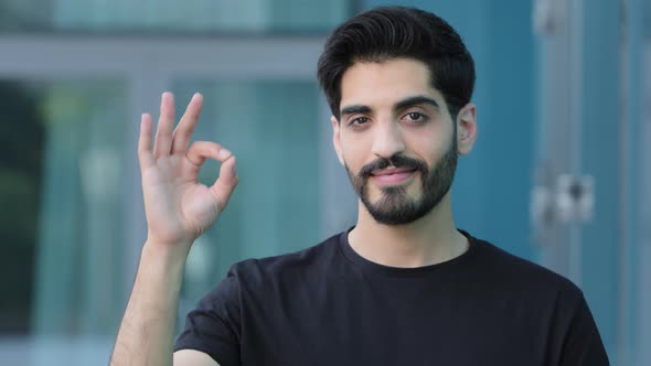 Headshot Happy Young Middle Eastern Man Showing Okay Gesture Satisfied Service alt