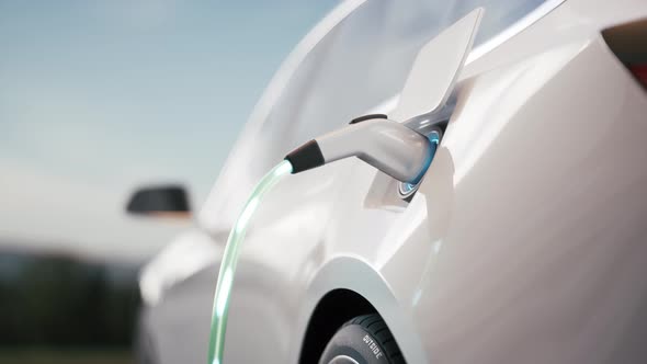 Electric Car Charging At A Charging Station alt