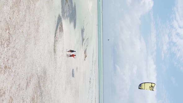 Zanzibar Tanzania  Vertical Video Kitesurfing Near the Shore of Ocean Slow Motion alt