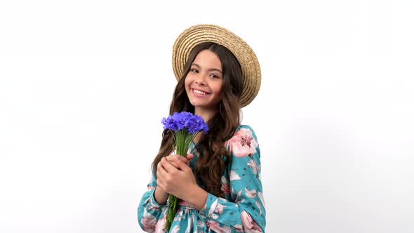 Cheerful Child in Summer Straw Hat Hold Wildflower Flower Bouquet Holding Centaurea Womens Day alt