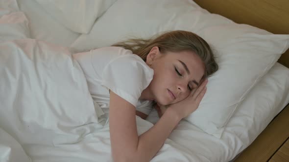 Attractive Young Woman Trying To Sleep in Bed alt