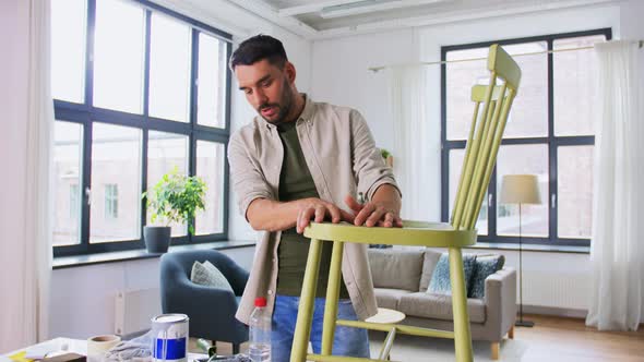 Man or Blogger Showing Old Chair Renovation alt