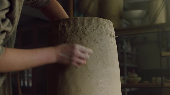 Beautiful Clay Vase Is Being Scraped By Potter alt