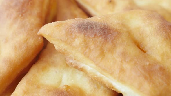 Tasty fried buns made in hot oil slow tilt 3840X2160 UltraHD footage - Close-up of golden  pirozhki  alt