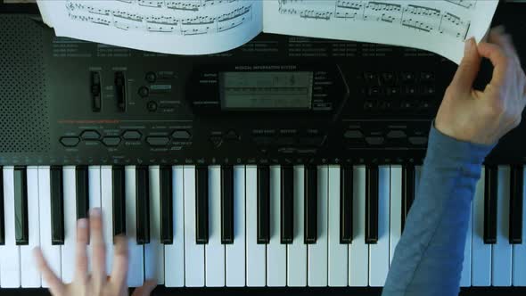 Female Hands Playing Piano. A Woman Touches the Keys with Her Fingers