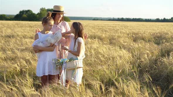 Happy Family Playing in a Wheat Field