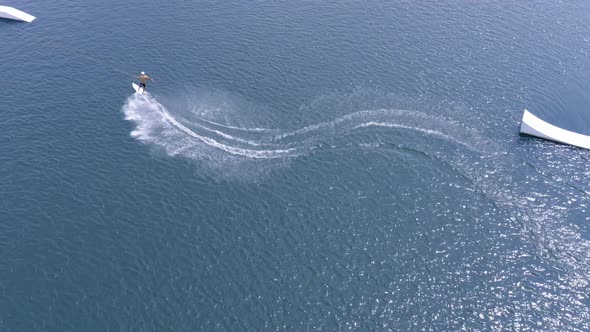 Wake surfer in a middle of wake park alt