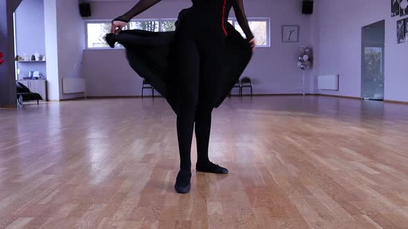 Slow motion female dancer spinning and does a split alt