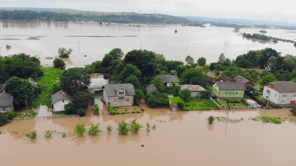 People Who Are in a Flooded House By a River That Overflowed After Rain Floods. Ecological alt