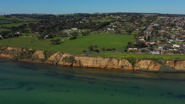 AERIAL TILT DOWN Limestone Cliff Face Of Clifton Springs, Australia alt