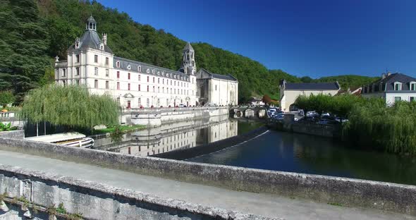 Aerial view of Benedictine Abbey of Brantome and river, France alt