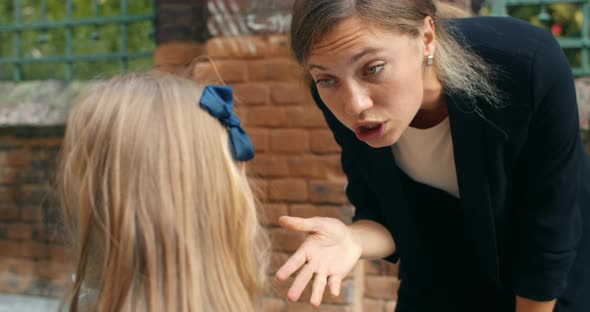 Close Up View of Mother Child Conflict, Young Angry Woman Yelling at Her Schoolgirl Daughter alt