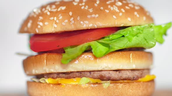 Panning Shot Rotating Juicy Fresh Fast Food Burger or Hamburger or Cheeseburger Closeup alt
