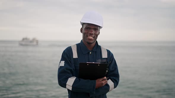 Seaman Has Communication with VHF Handheld Radio alt