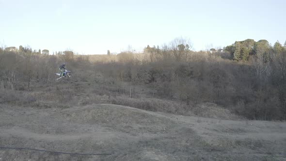 Motocross rider on a dirt track alt
