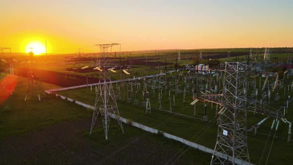 Silhouette High Voltage Electric Tower on Sunset Time and Sky on Sunset Time Background alt