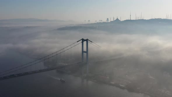 aerial video of bosphorus Bridge on a foggy day in Istanbul, Turkey, Martyrs Bridge alt