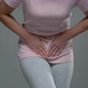 Woman Writhing From Pain in Lower Abdomen, Menstrual Pain, Risk of Miscarriage - VideoHive Item for Sale