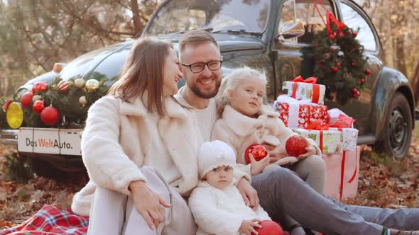 Young Family with Children at a Christmas Photo Shoot