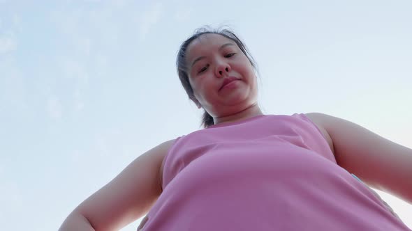 Unhappy boring overwieght of young sport Asian fat woman serious with belly stomach alt