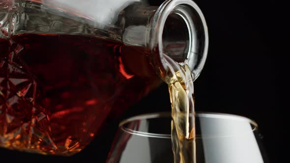 Pouring Brandy or Whiskey Closeup alt