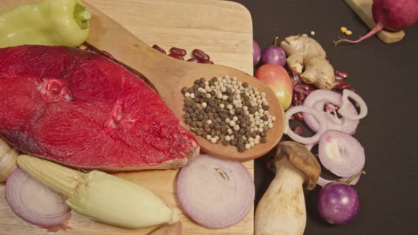 Top View Fresh Fish Fillets And Cooking Equipment Preparation On Cutting Board. alt