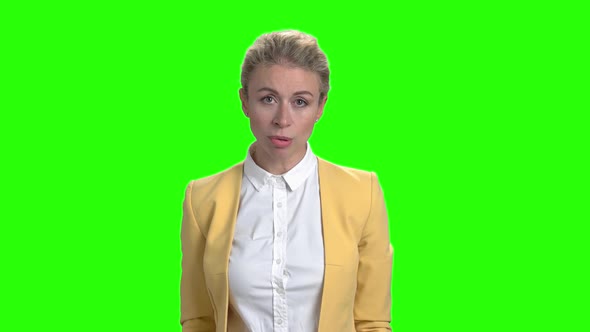 Young Angry Business Woman on Green Screen. alt