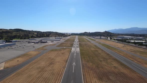 A forward aerial view approaching the runway at Brackett Field near La Verne, California. Helicopter alt
