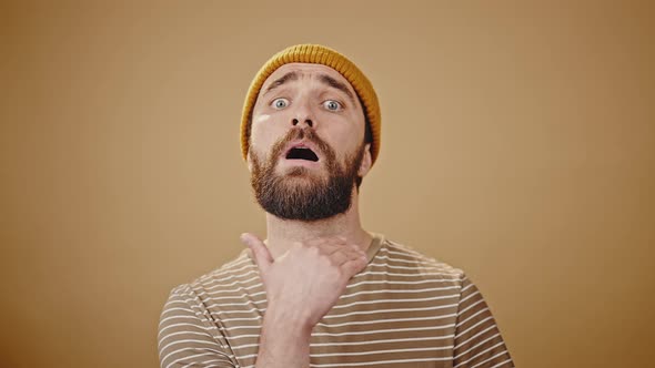 Breaded Midlife Man Looks Angry and Threatens Closeup alt