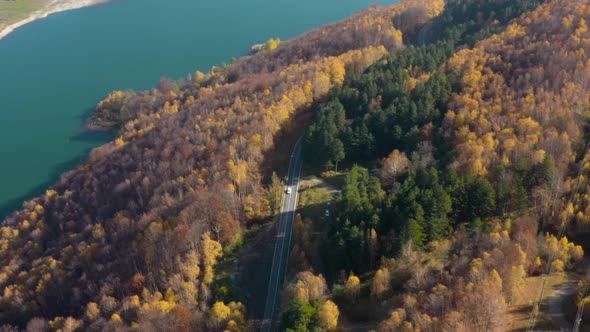 Flying Above Dam Lake and Road alt