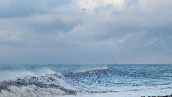 Big Sea Waves Crashing on the Shore Blue Water Background
