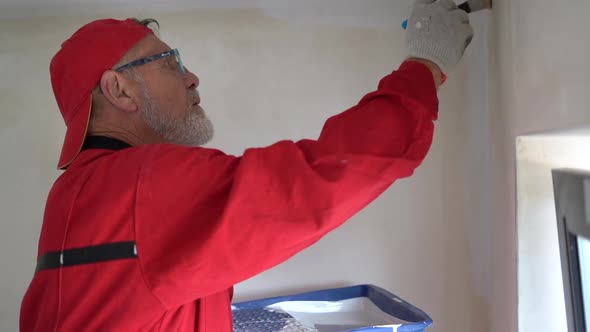 Man Makes Repairs at Home alt