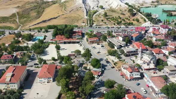 aerial panning shot of residential buildings in a Pamukkale Turkey famous for its white mineral rich alt