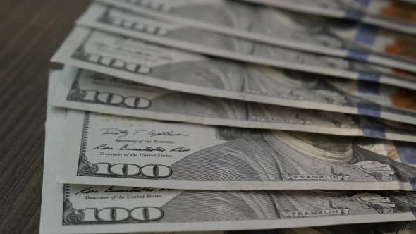 Taking American   paper currency  slow motion 1080p FullHD footage - Dollar bills  on table   slow-m alt