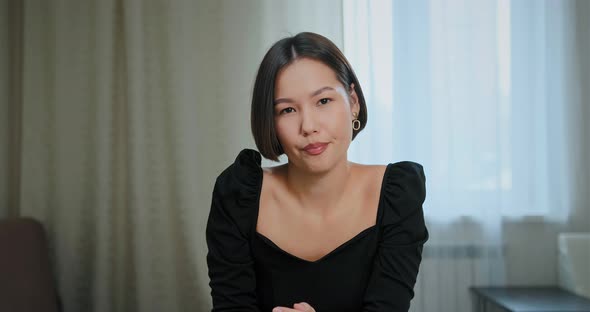 Young Woman Talks Looking Into Computer Camera at Home alt