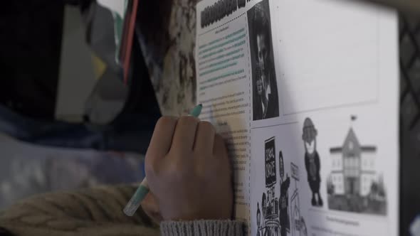 Right Hand Of Teenager Writing Using Blue Highlighter On Homework. Vertical Video, Locked Off alt