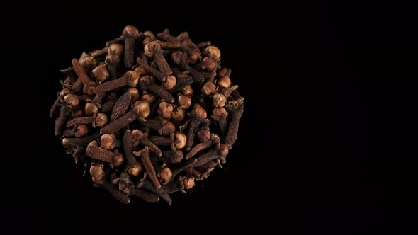 Whole Cloves on black background, rotate. Spice cloves alt
