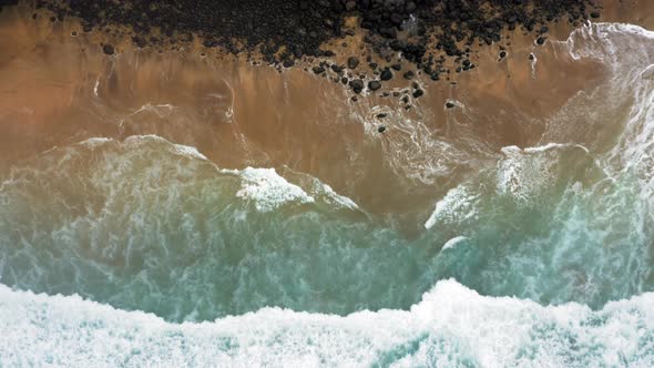 Aerial View Over Beautiful Clear Ocean Wave Rolling on Wild Sandy Beach ...