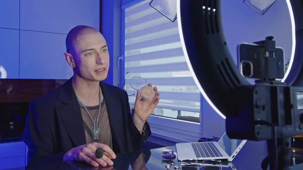 Queer Caucasian Influencer Presenting New Powder to His Followers During Video Stream alt