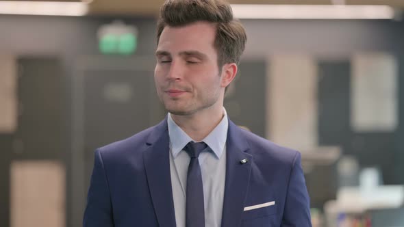 Portrait of Businessman Showing No Sign By Finger Denial alt