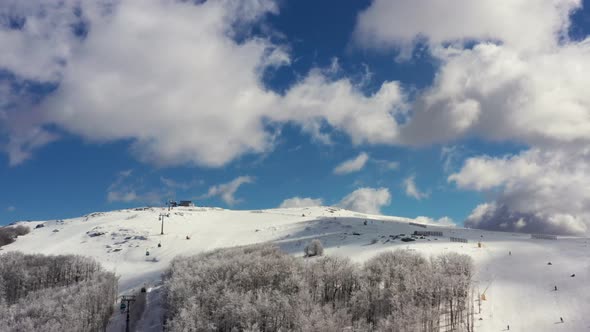 Aerial view at the mountain on a sunny winter day